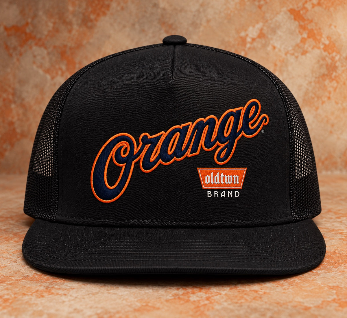 OLDTWN Orange Script embroidered black mesh-back snapback, front view